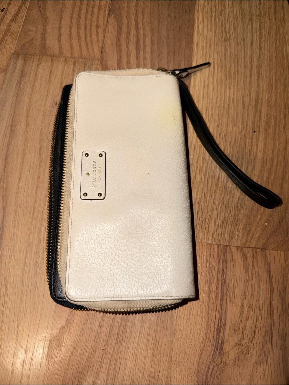 kate spade cream wristlet wallet with black strap